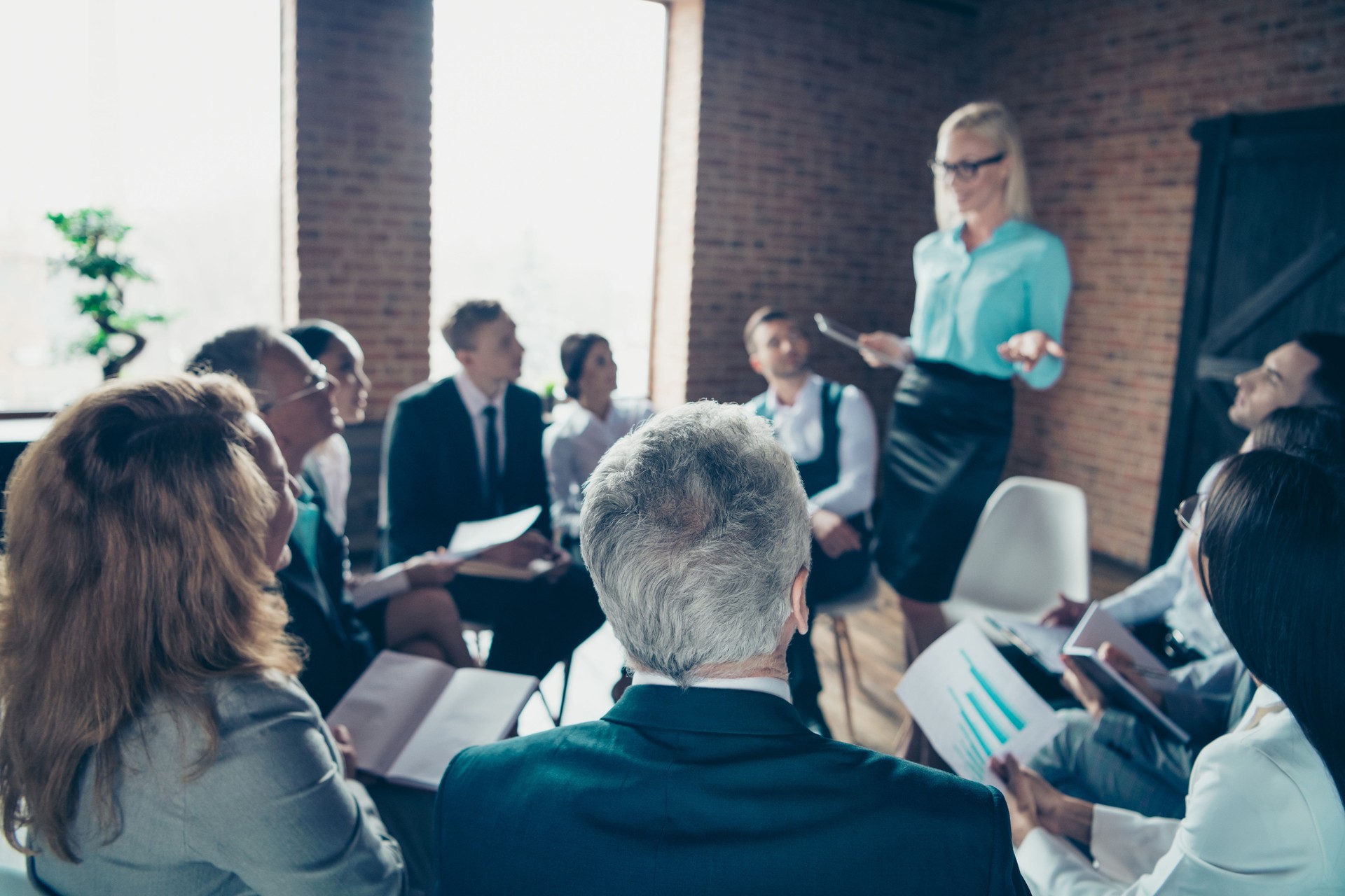 Nice stylish elegant chic attractive sharks experts listening to economist finance report data analysis analyst at modern industrial loft interior work place space indoors